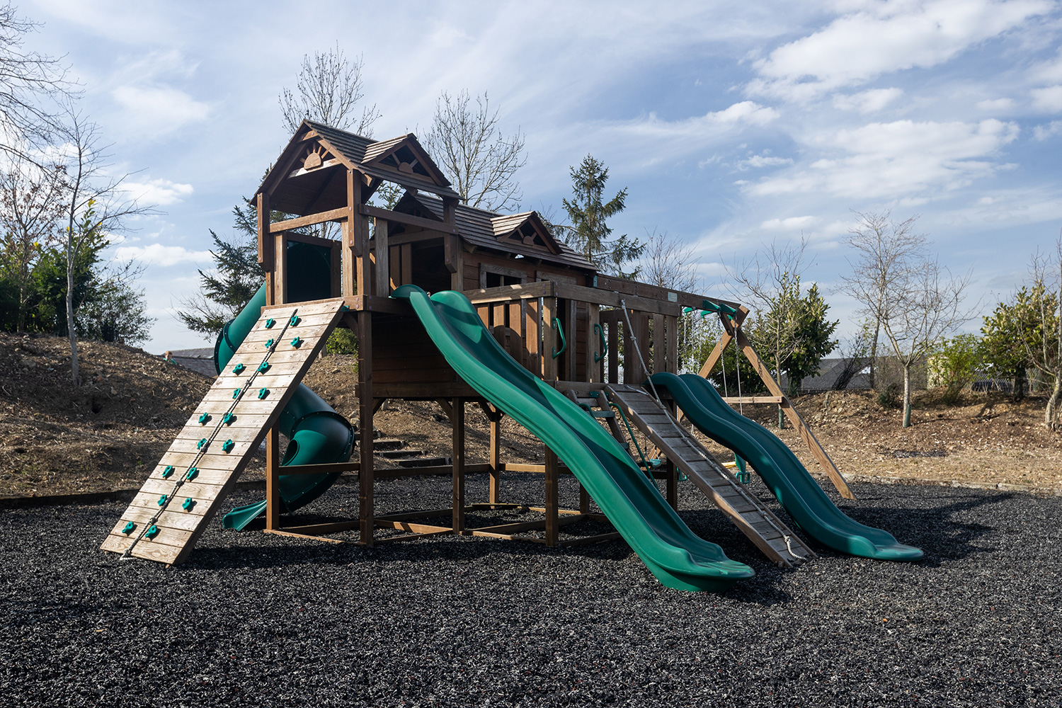 Climbing play area with slides and netting